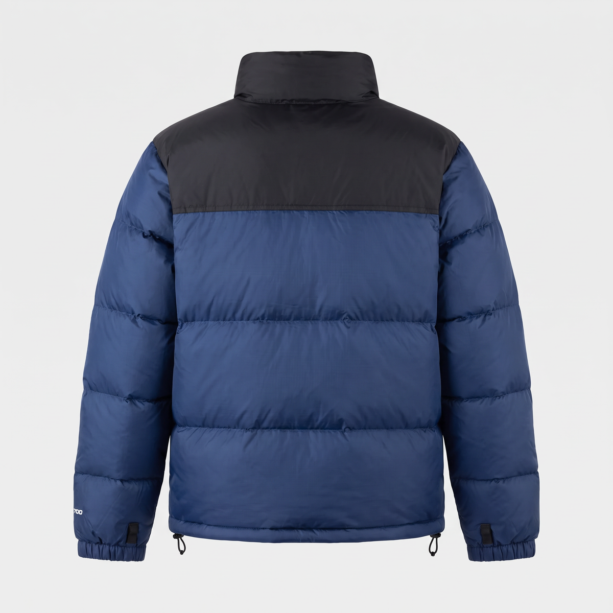 Back view of the Navy Terrabound colour block puffer jacket showing the black upper yoke and the baffle rows