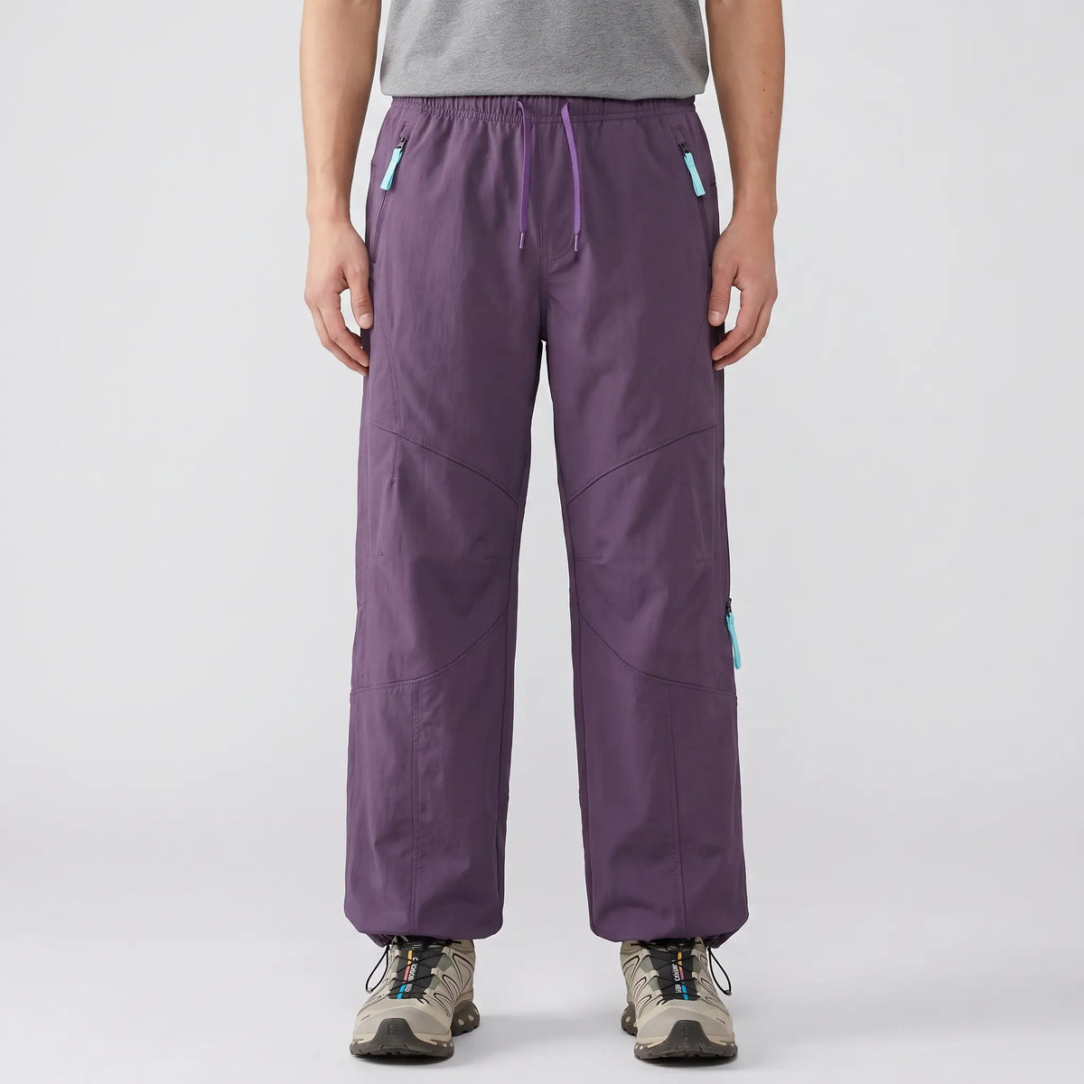 Front view of the Meadow Purple Terrabound wide-leg Hiking Trousers: drawcord waist, zip hand pockets, darted knees, ankle drawcords
