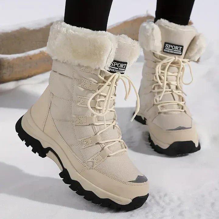 Woman wearing the fur lined winter boots in Beige in the snow