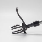 Close-up of the four-claw steel head and curved foot pedal