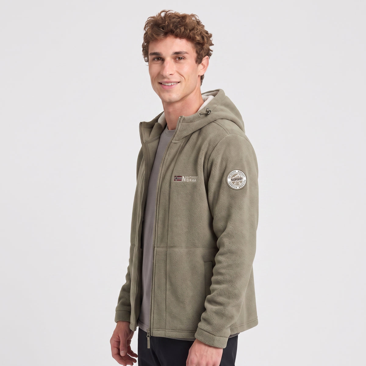 Men's khaki windproof fleece jacket worn, three-quarter view