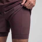 Close-up of the compression liner showing the bonded seam, laser-cut ventilation perforations and thigh phone pocket