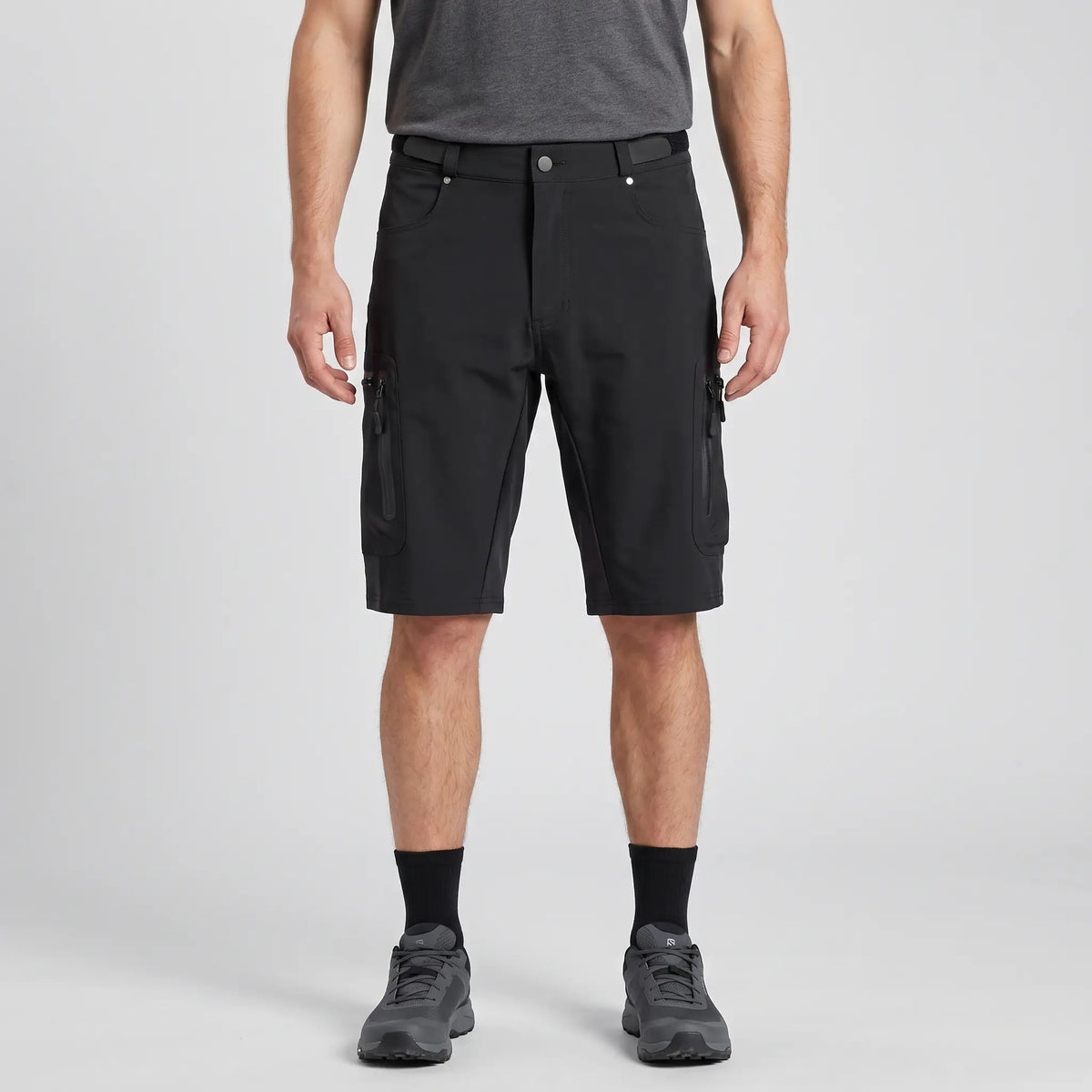 Black MTB shorts worn, front view with zipped thigh pockets
