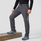 Men's fleece lined walking trousers in Dark Grey, side view with reinforced knee panel and reflective strips