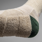 Macro close-up of the looped terry cushioning on the sole beside the flatter open-knit instep