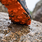 Multi-directional lugged outsole close-up, Grey/Orange