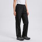 Women's rain trousers three-quarter view with the reflective strip and ankle tab on the outer leg