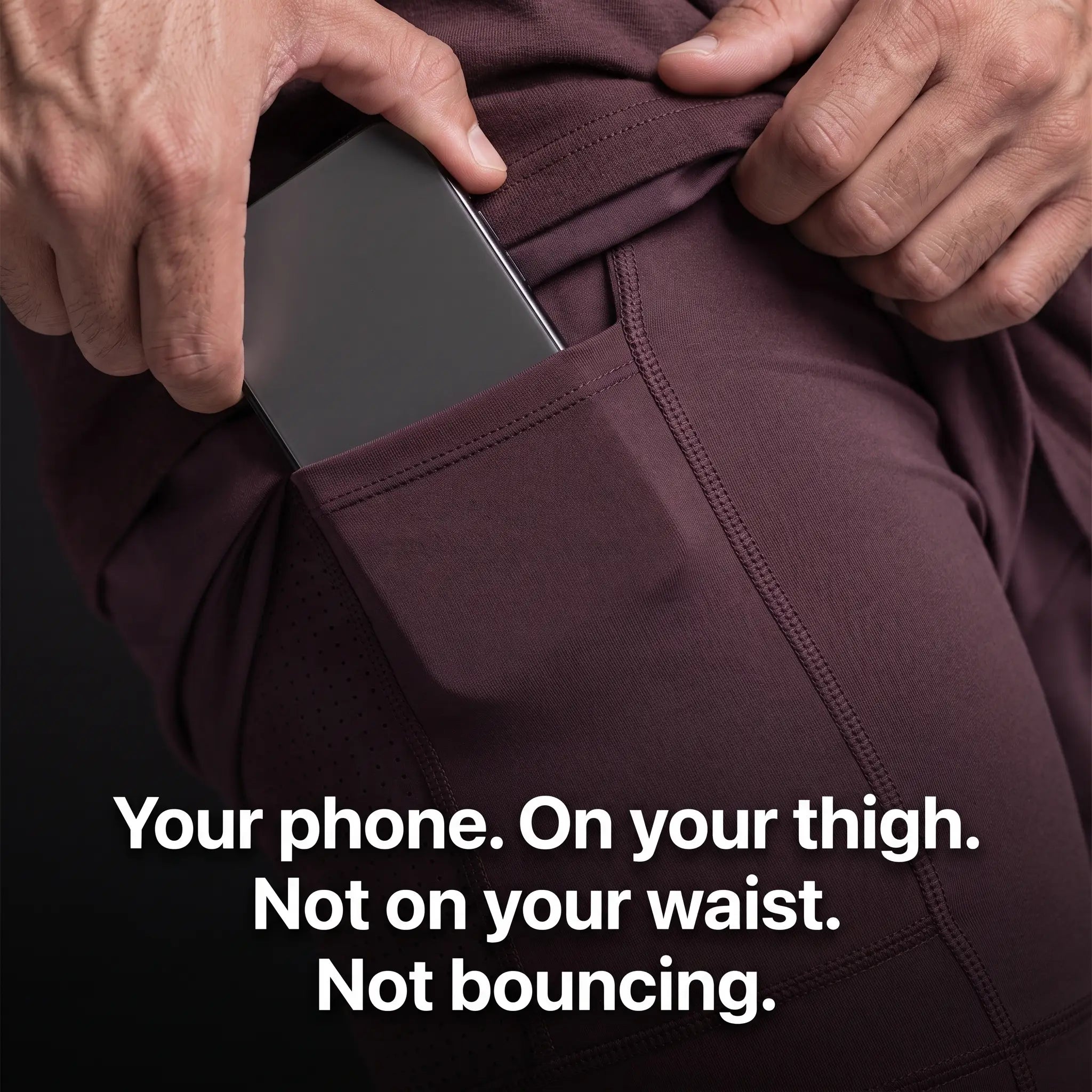 A phone sliding into the phone pocket on the compression liner thigh