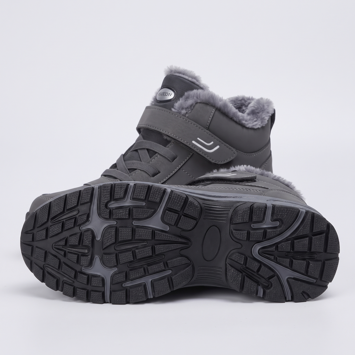 Lugged rubber outsole of the winter boot with deep multi-directional lugs