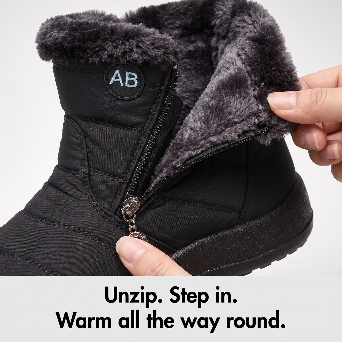 Close-up of the side zip opened halfway to show the plush faux fur lining inside the boot