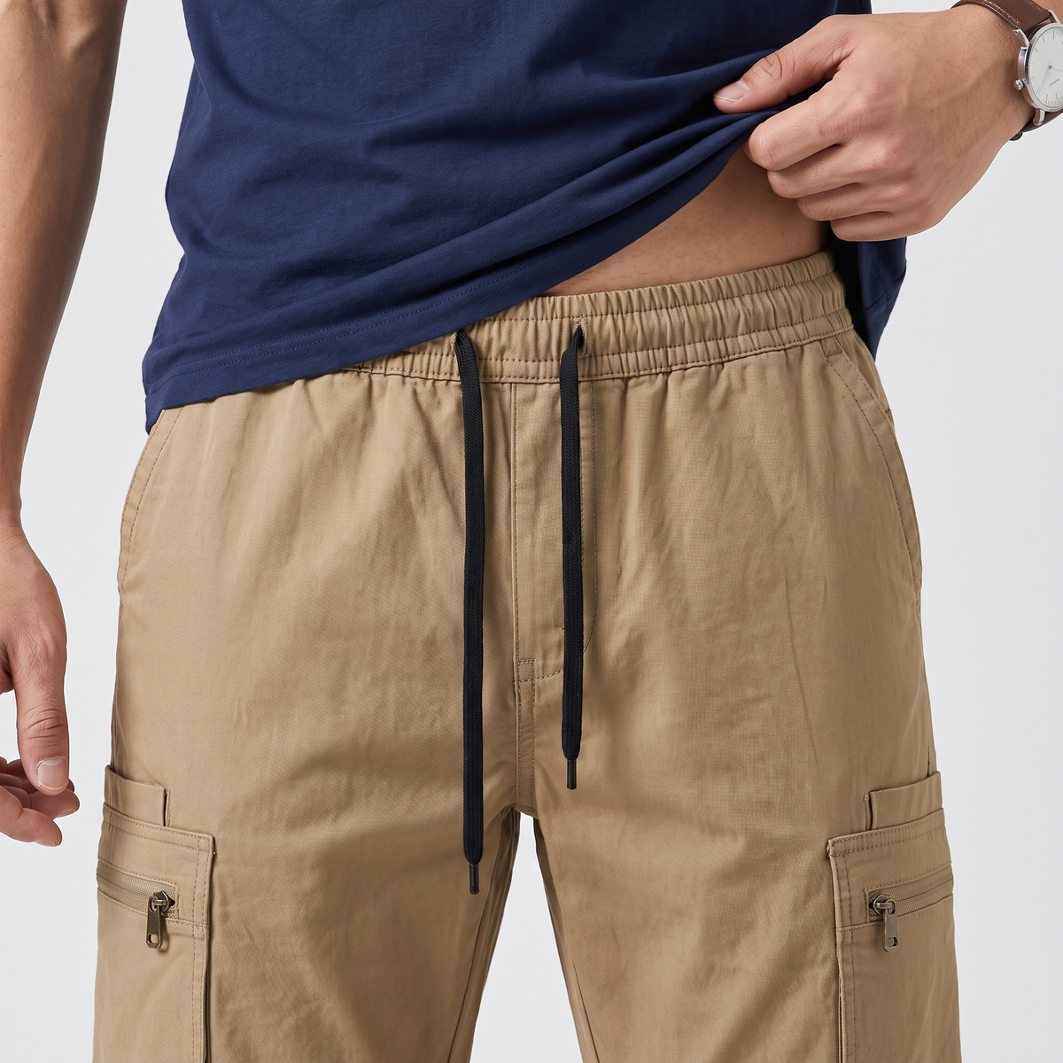 Close-up of the elasticated waistband and drawcord on the Dark Khaki combat trousers