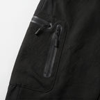 Close-up of the two coated zips on the cargo pocket