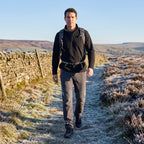 Man wearing Dark Grey fleece lined walking trousers on a frosty Peak District moor path
