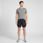 Full length view of a man wearing the Black 2 in 1 running shorts