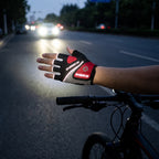 Reflective trim on the cycling glove catching light in low light conditions