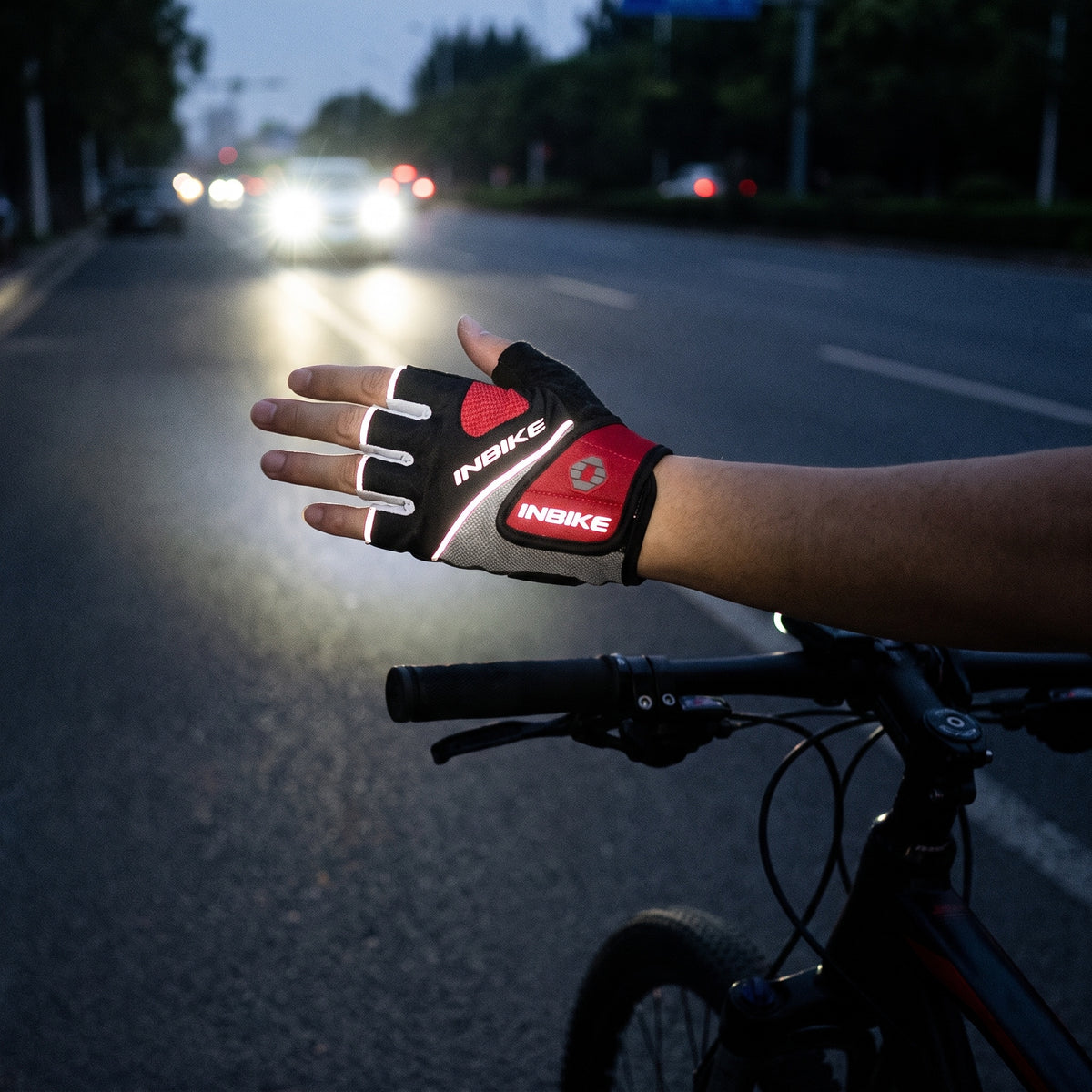 Reflective trim on the cycling glove catching light in low light conditions