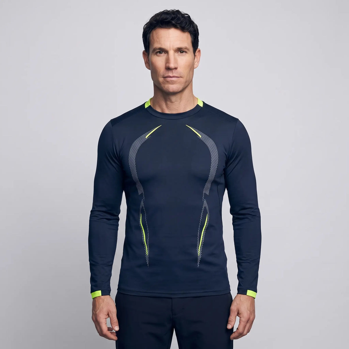 Man wearing the long sleeve running top in Navy Blue, front
