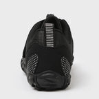 Heel of the black barefoot shoe with striped pull tab