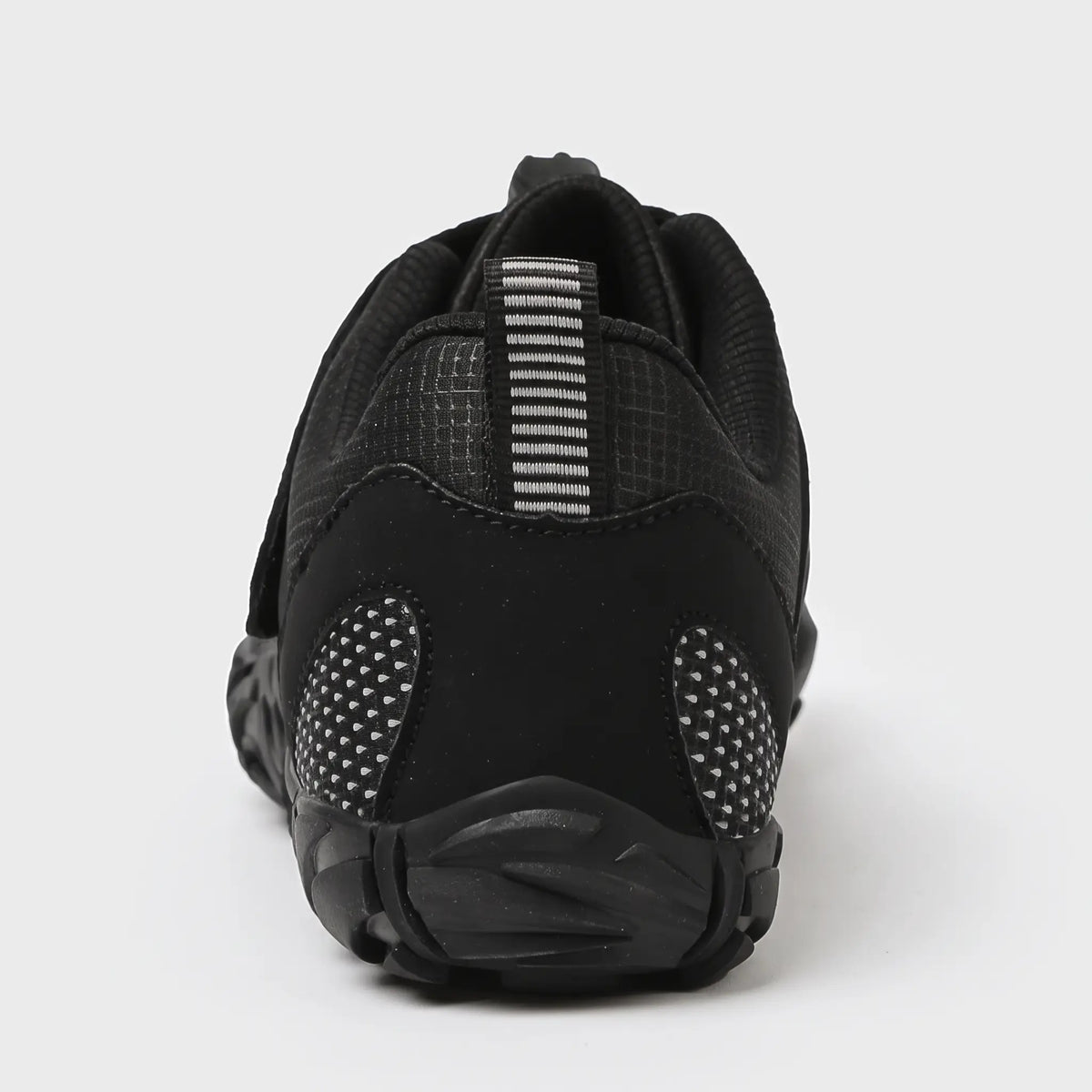 Heel of the black barefoot shoe with striped pull tab