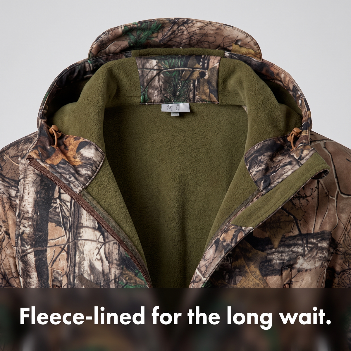 Fleece lining inside the collar and hood of the camo softshell jacket