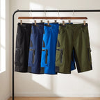 MTB shorts in Black, Dark Blue, Light Blue and Green on a rail