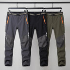 Men's fleece lined walking trousers in Dark Grey, Black and Olive on a rail
