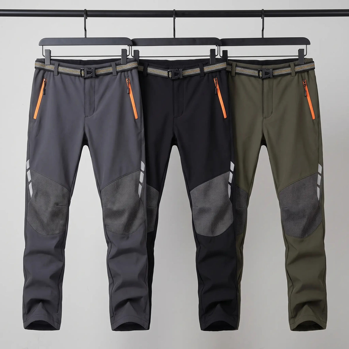 Men's fleece lined walking trousers in Dark Grey, Black and Olive on a rail