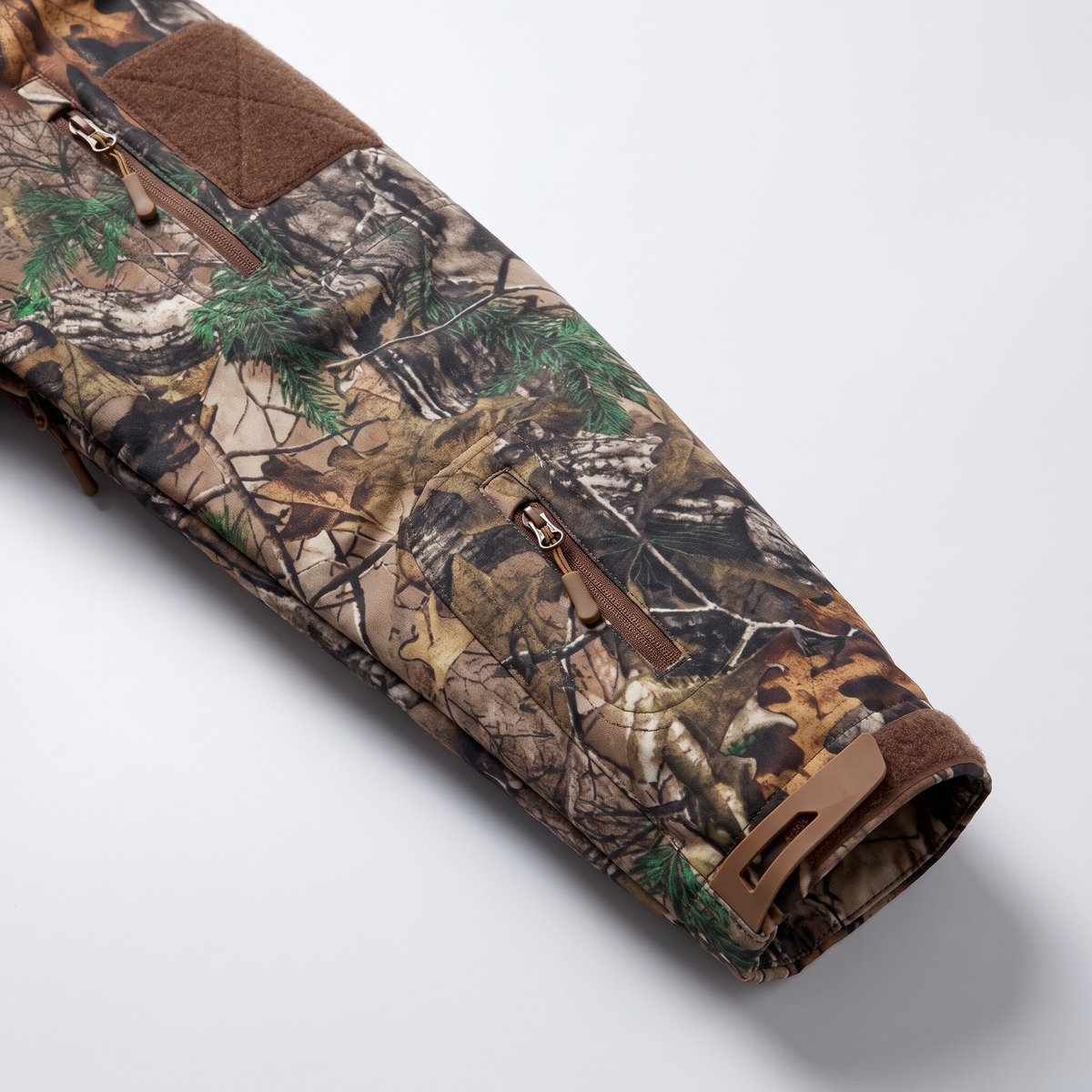 Sleeve patch panel, sleeve zip pocket and adjustable cuff tab