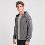 Men's grey windproof fleece jacket worn, three-quarter view