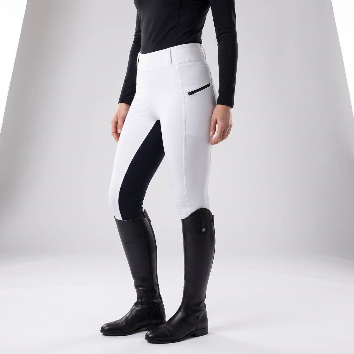 White two-tone jodhpurs from the side with the zip pocket and dark inner-leg panel
