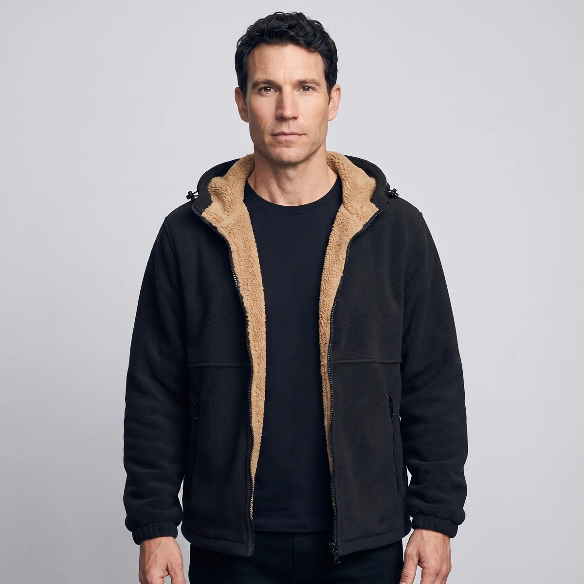 Men's sherpa jacket in Black worn open over a black T-shirt