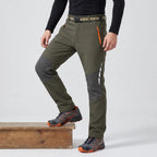 Men's fleece lined walking trousers in Olive, side view with knee bent