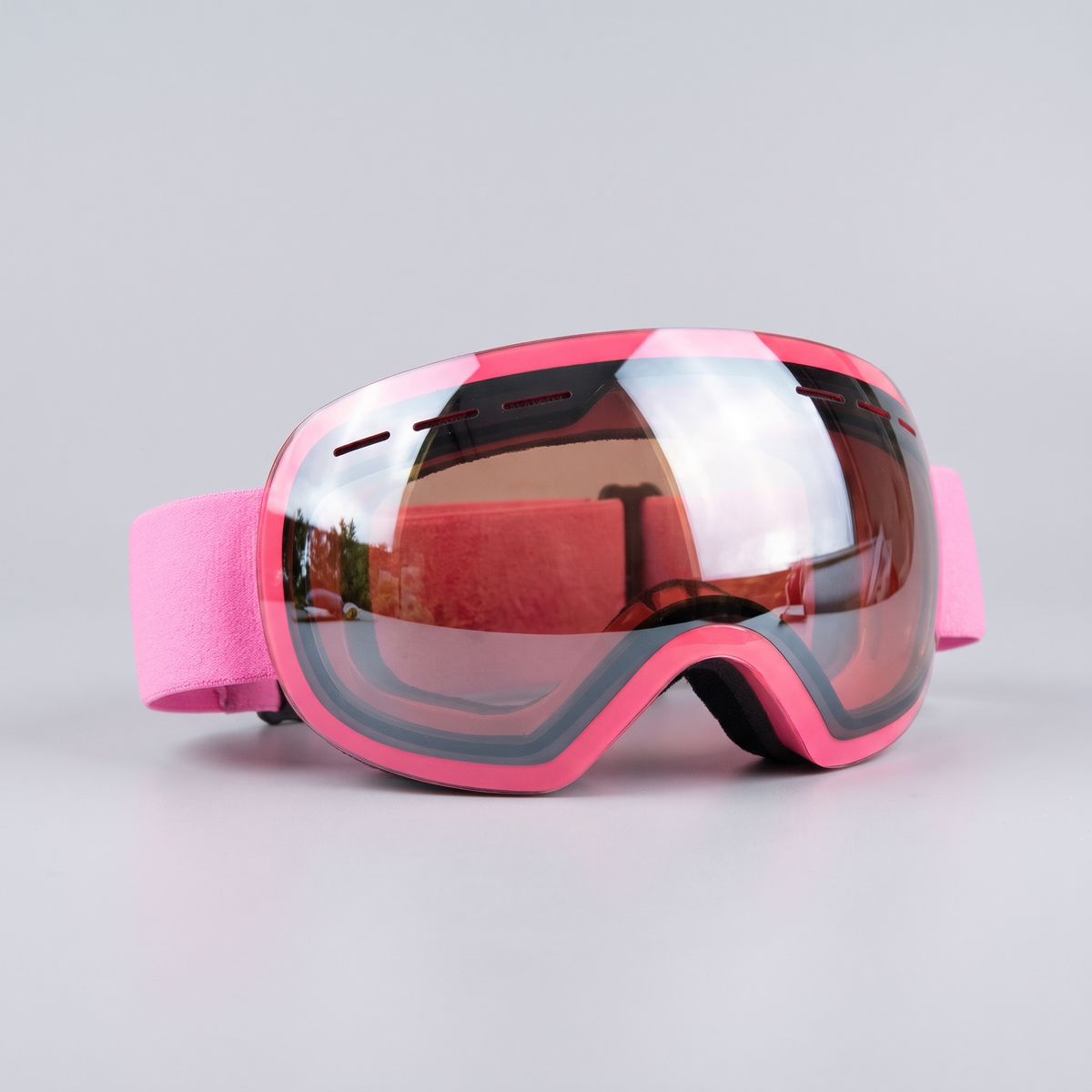 Pink ski goggles with pink frame and pink strap
