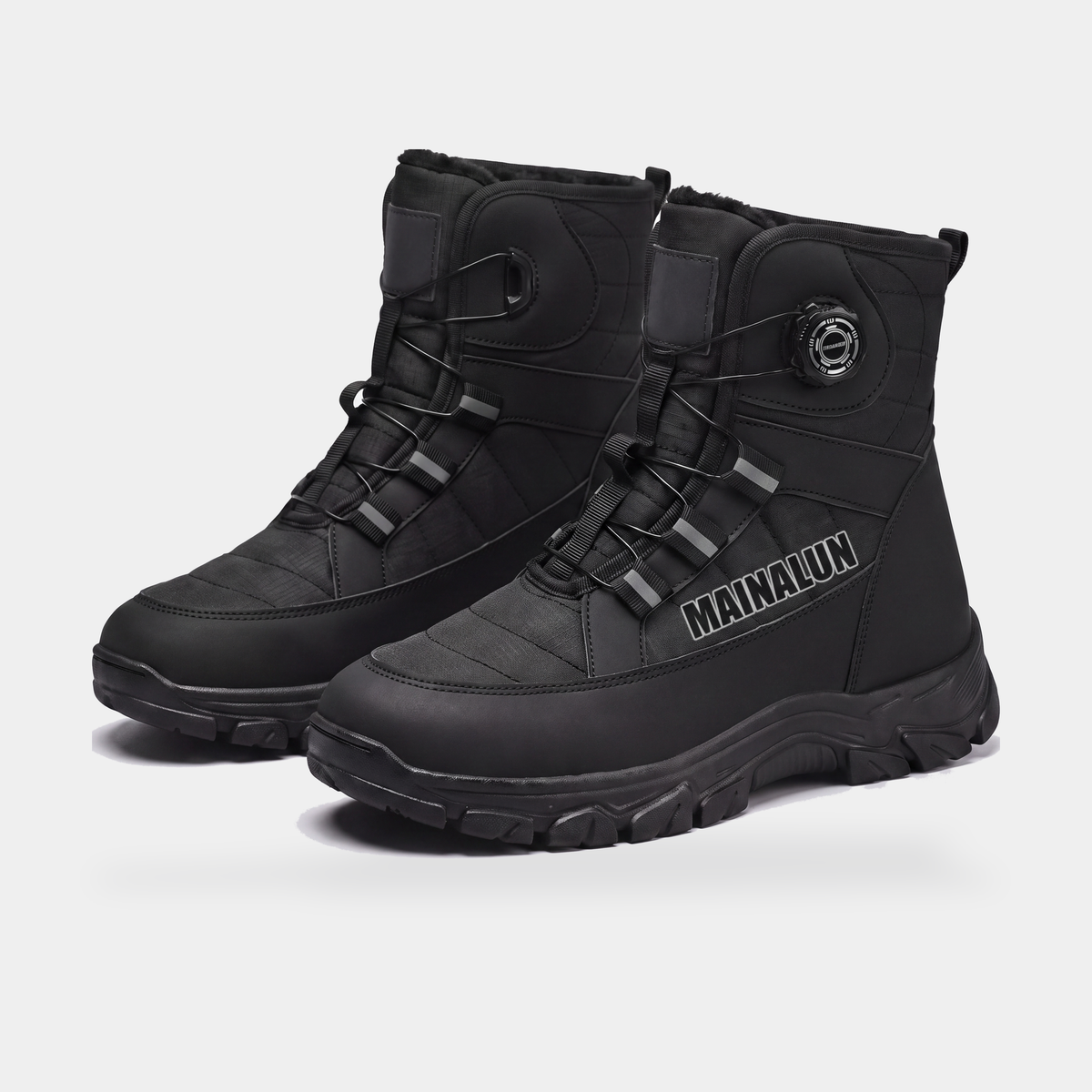Black MAINALUN snow boots with rotary dial fastening, pair, three-quarter front view