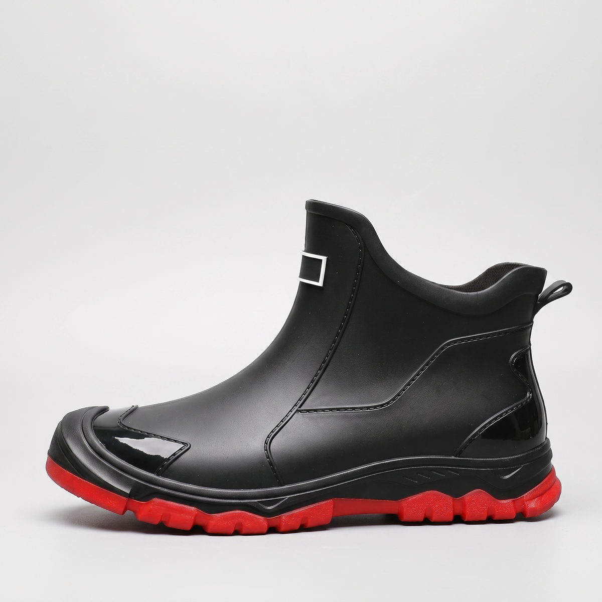 Black ankle wellies with a red sole, short slip-on wellington boots