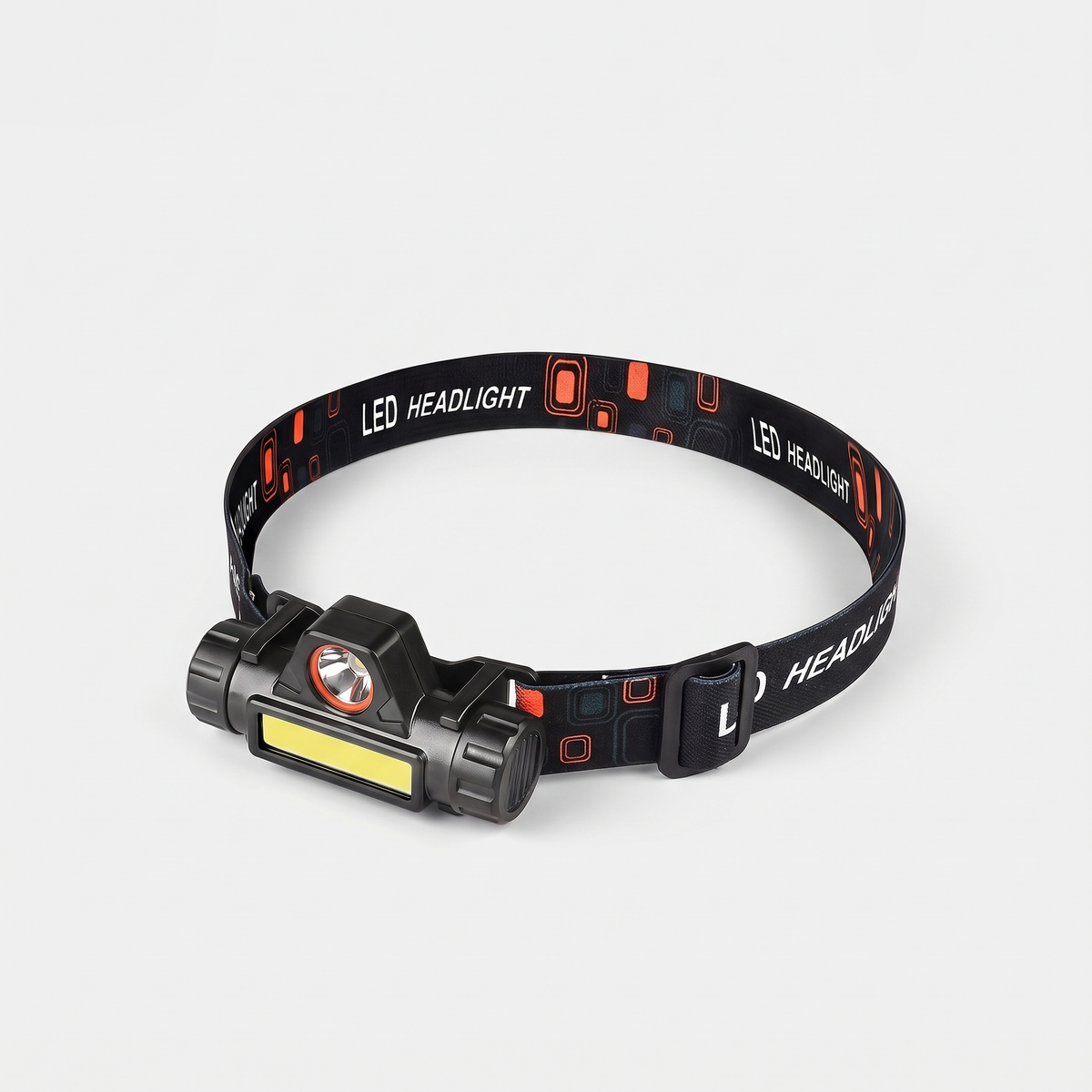 USB rechargeable head torch with a wide COB flood bar and round spot LED on a printed LED HEADLIGHT headband, three-quarter view