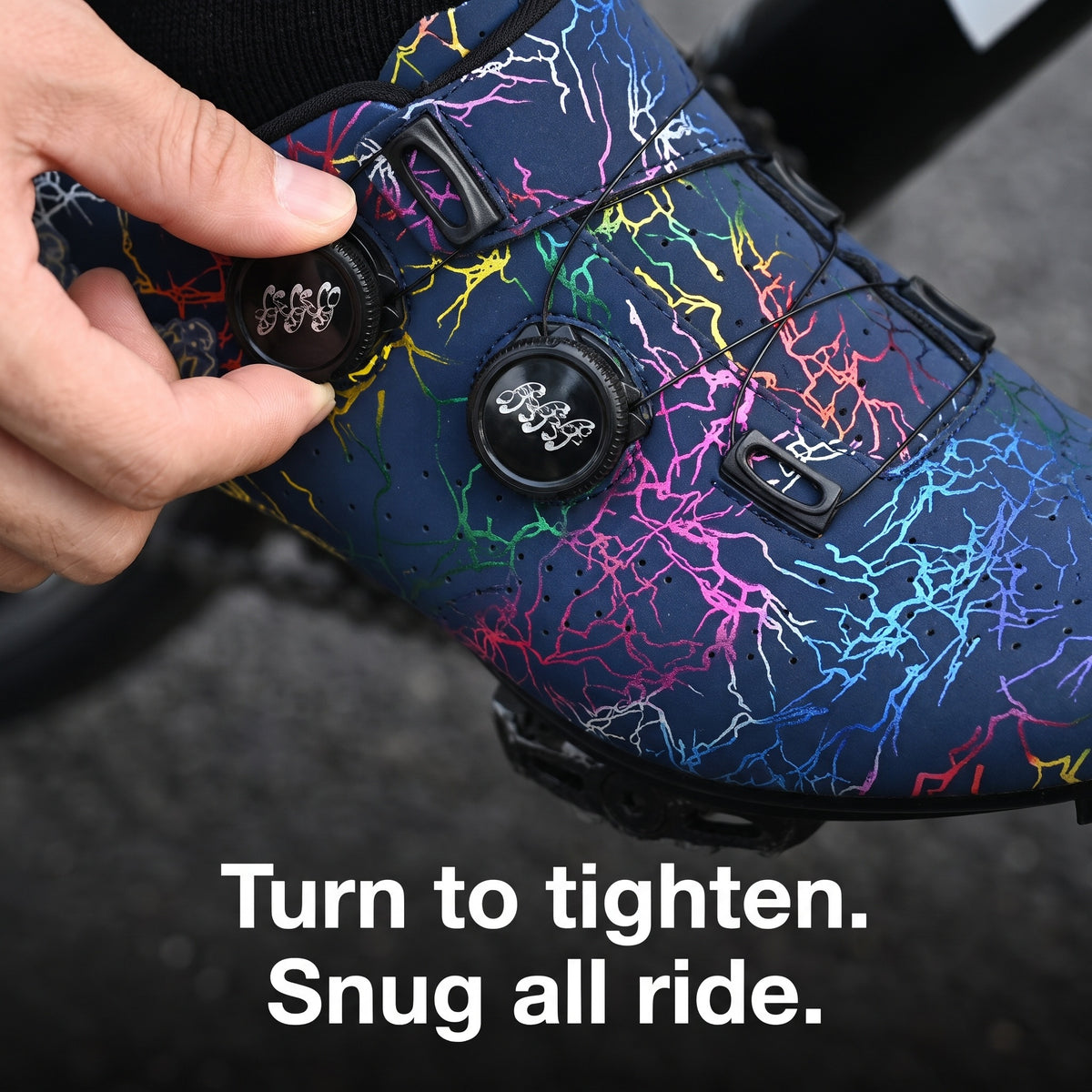 Hand turning one of the two dials on a Dark Blue cycling shoe