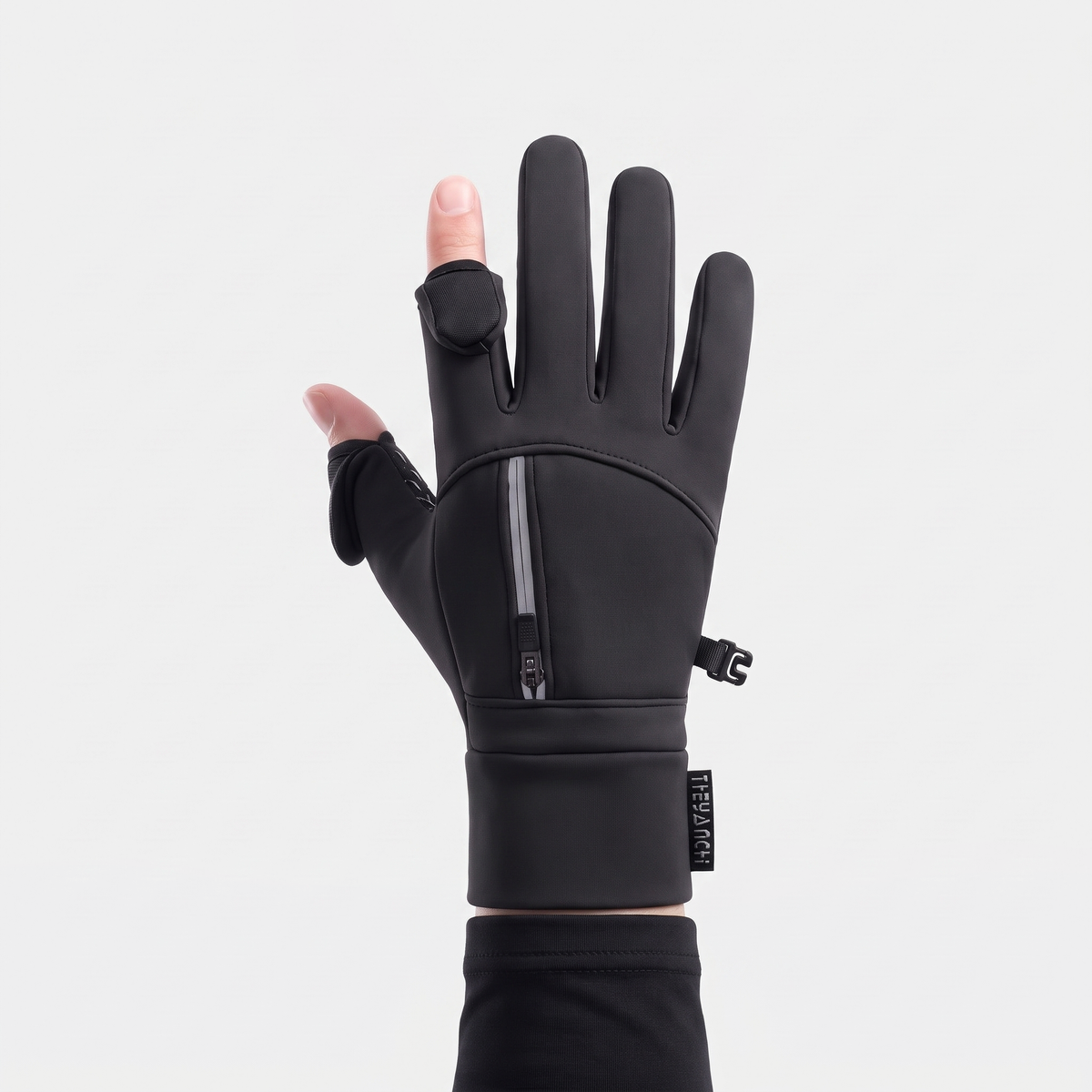 Back of the winter glove with the zipped pocket and cuff clip, thumb and index caps folded back