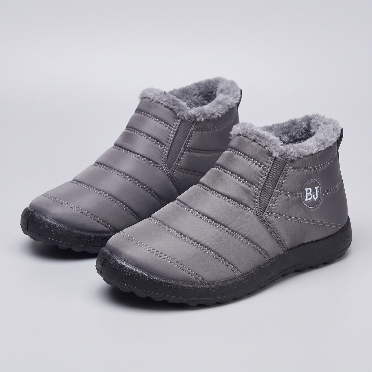 Women's slip-on snow boots, pair in Grey, front three-quarter view