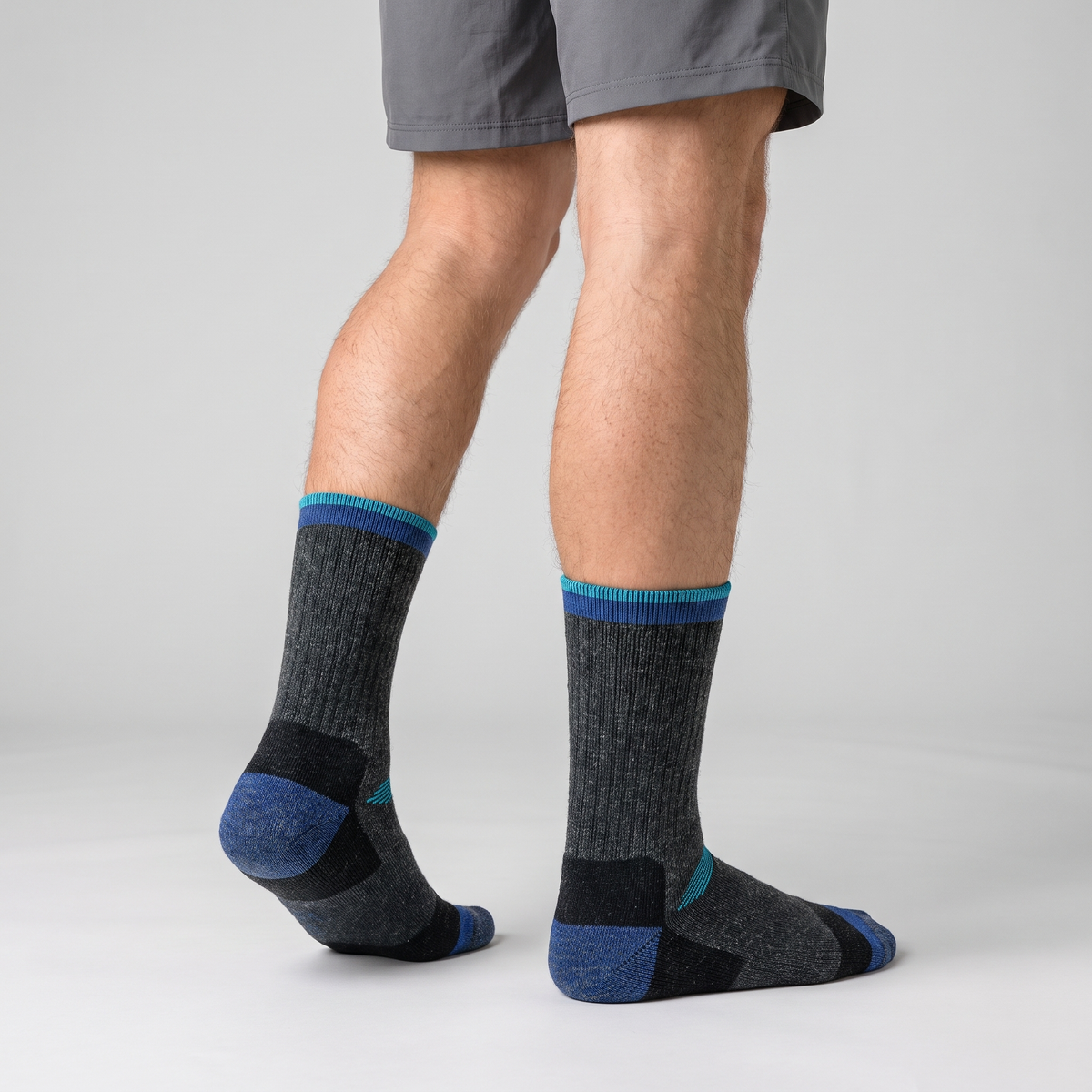 Navy ski socks worn, three-quarter rear view of the heel and cuff