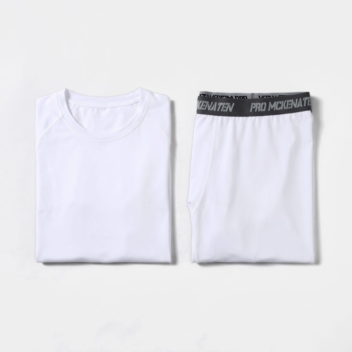 White long johns set folded flat, base layer top and leggings side by side