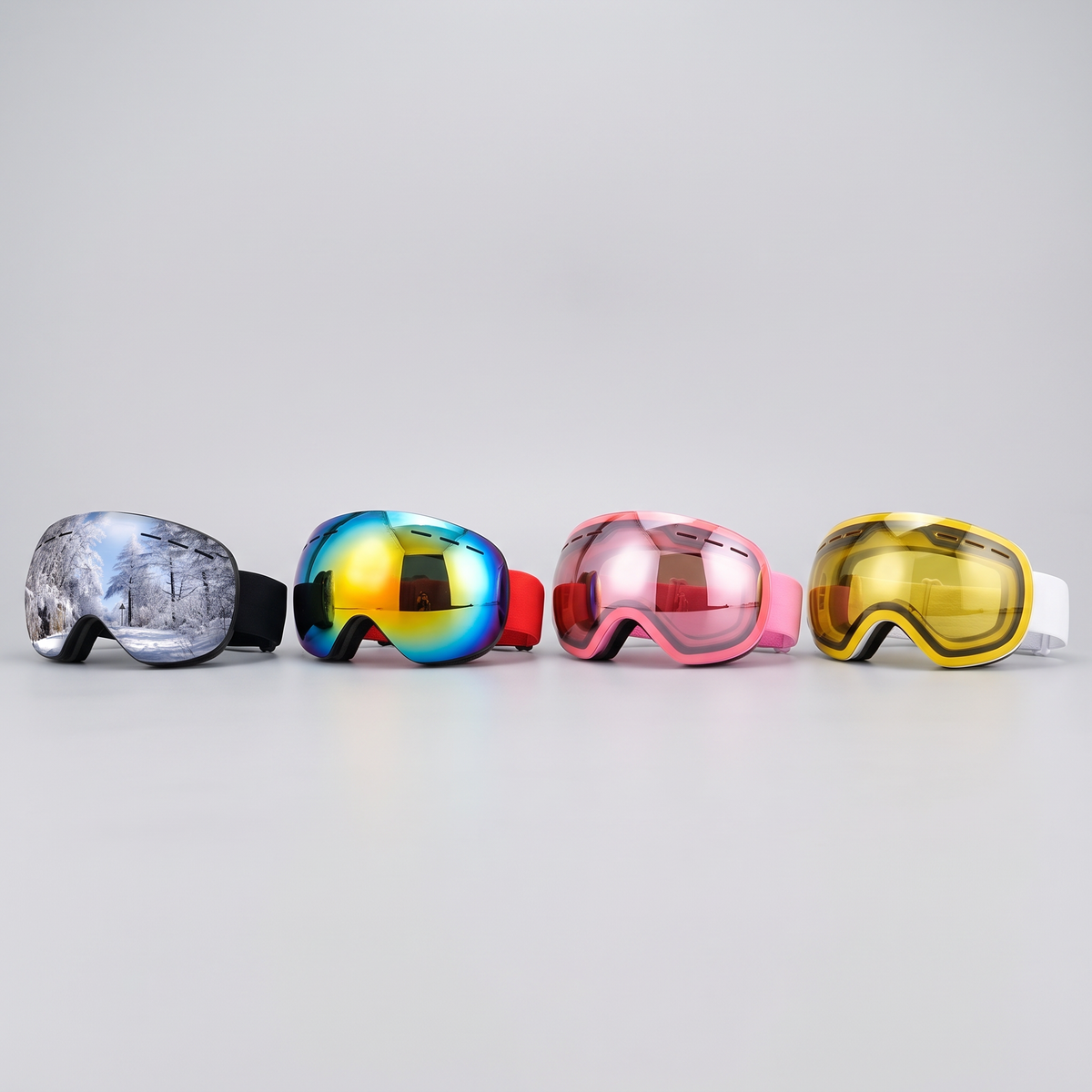 Ski goggles in four colours: black, red, pink and golden