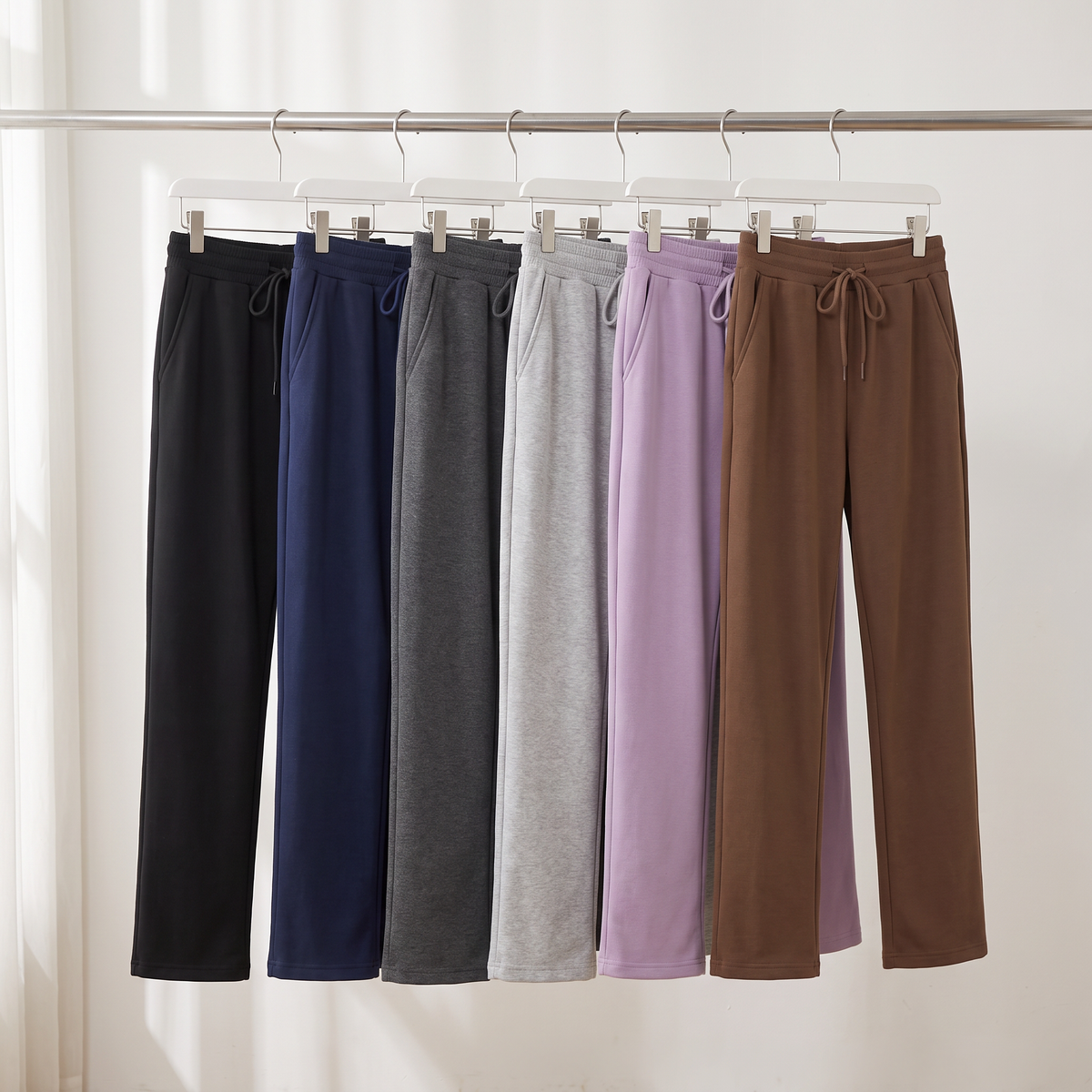 The fleece lined joggers in six colours hanging on a clothes rail