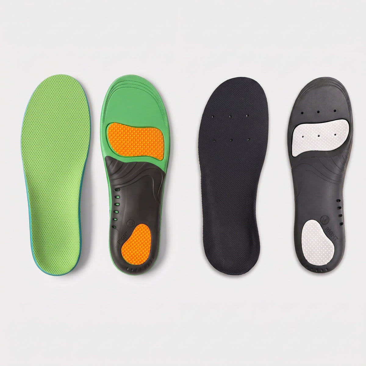 Arch support insoles in green and black, tops and undersides