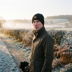 Man wearing the black fleece lined beanie on a frosty morning dog walk