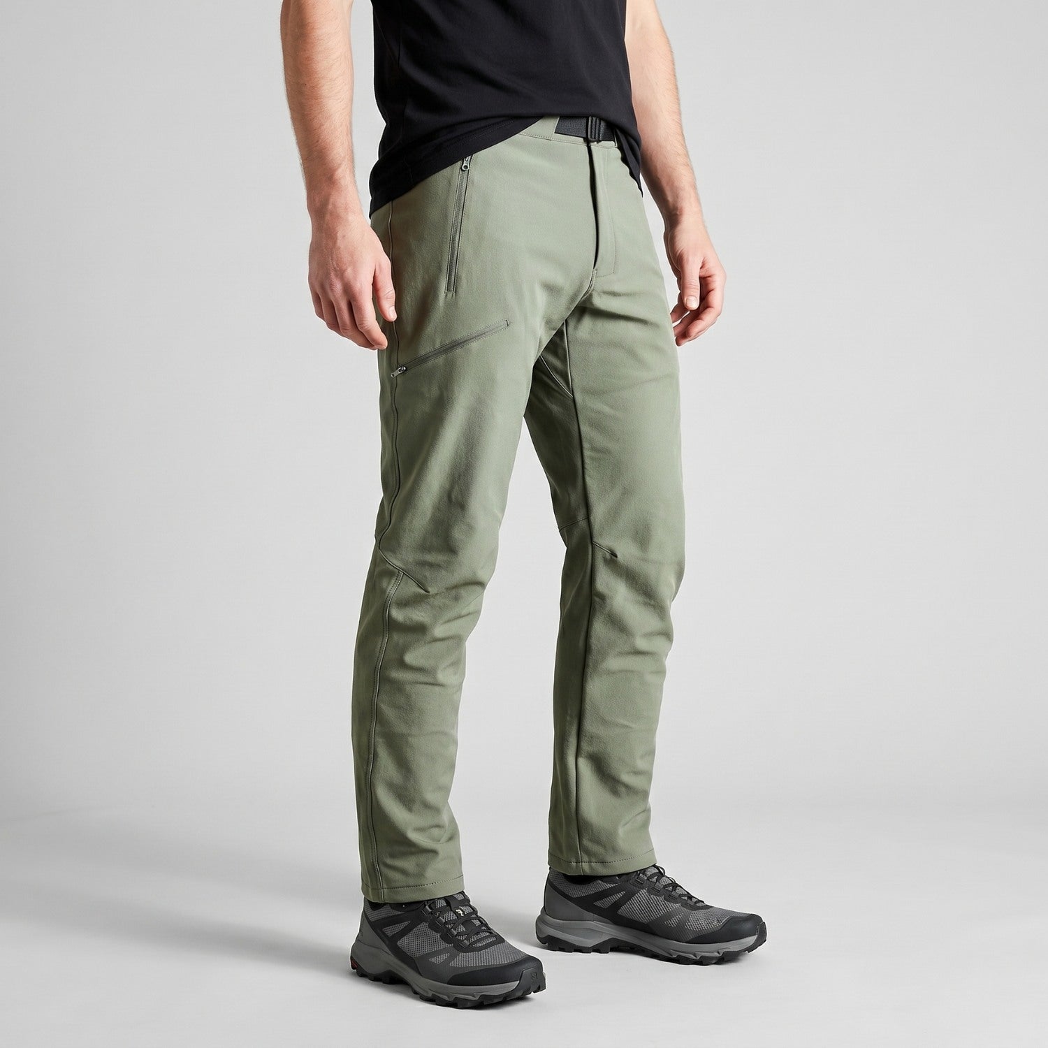 Men's sage green walking trousers worn, three-quarter view