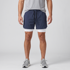 Man wearing the Navy 2 in 1 running shorts, front view