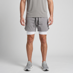 Man wearing the Light Grey 2 in 1 running shorts, front view