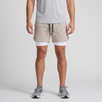Man wearing the Khaki 2 in 1 running shorts, front view