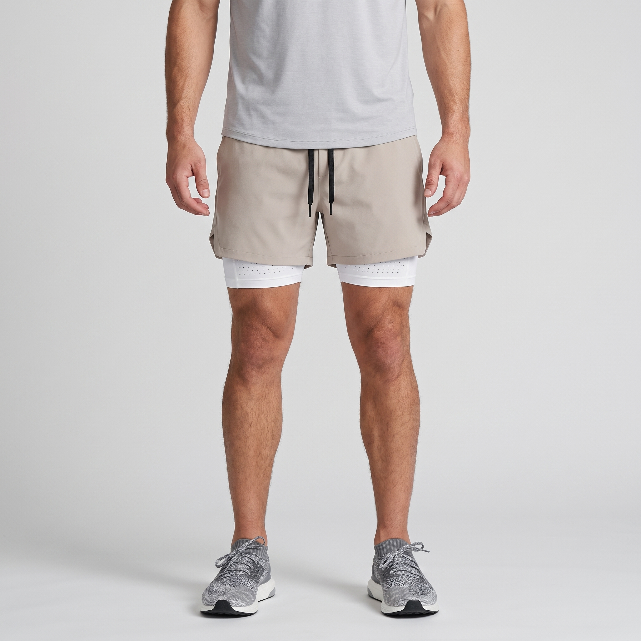 Man wearing the Khaki 2 in 1 running shorts, front view